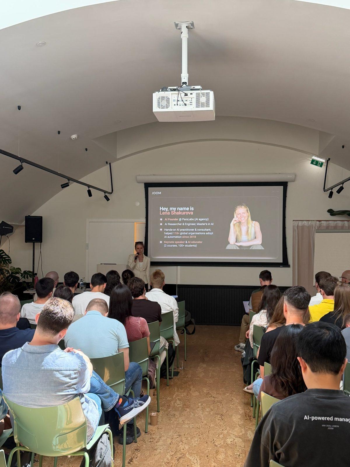 Lena opening a session of the three-day AI Manager Intensive in Lisbon, with her introduction slide on screen
